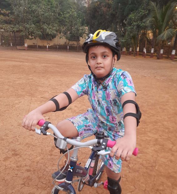 A girl wearing all cycling accessories with a cycle